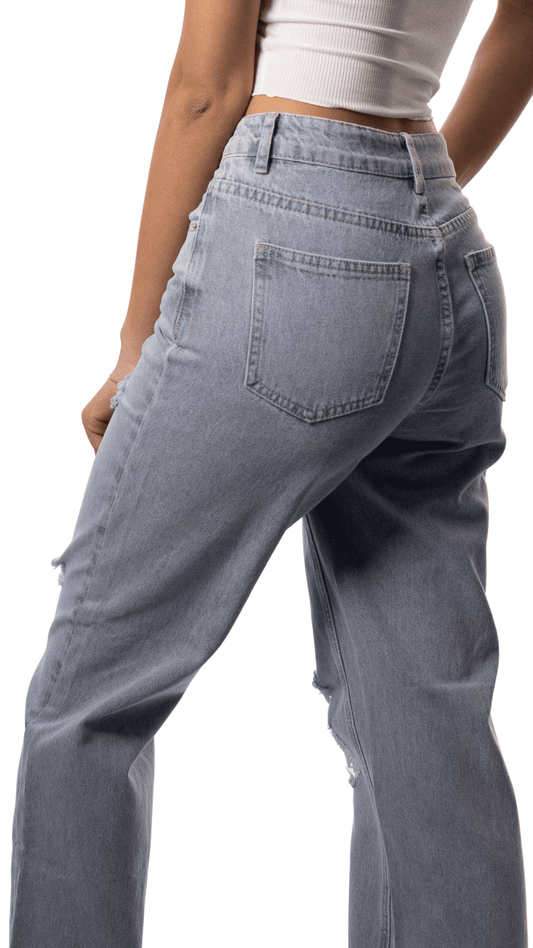 Light blue jeans worn by a lady on a white background