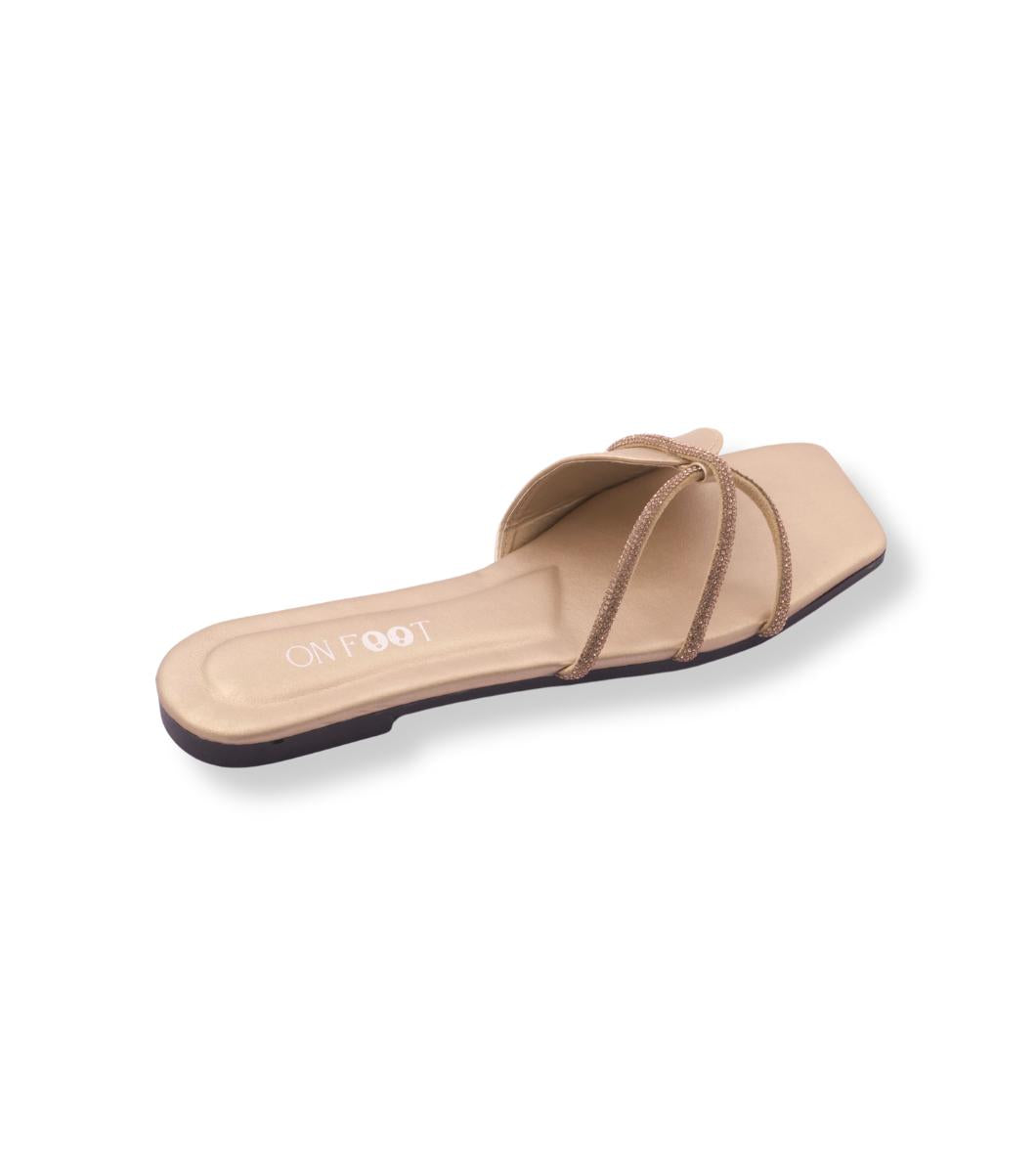 Beige sandal with a bow on a white background