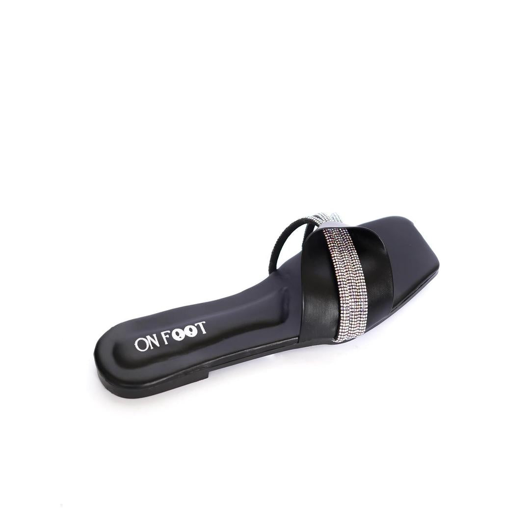 Black sandal with a decorative strap on a white background