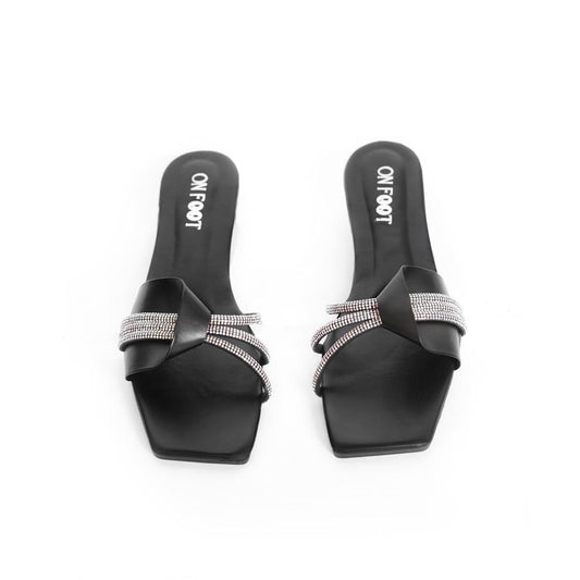 Black slides with rhinestone straps on a white background