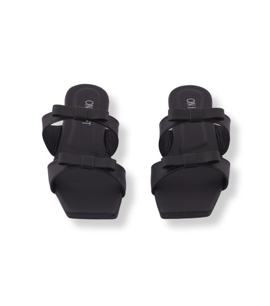 Pair of black knee pads on a white background