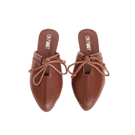 Pair of brown pointed-toe shoes with braided details on a white background