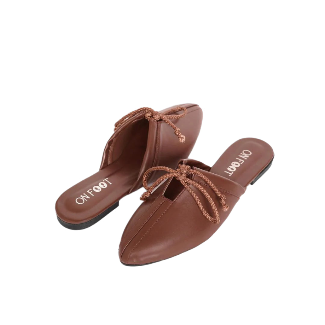 Brown shoes with decorative laces on a white background