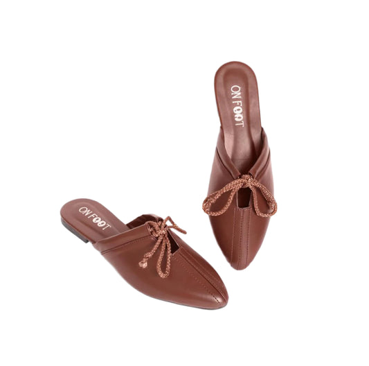 Brown leather mules with crochet details on a white background