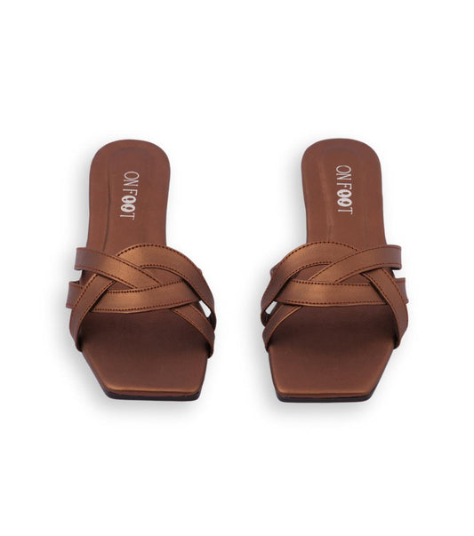 Pair of brown sandals with woven design on a white background