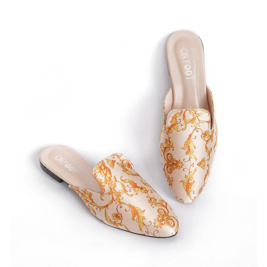 Pair of decorative shoes with gold patterns on a white background