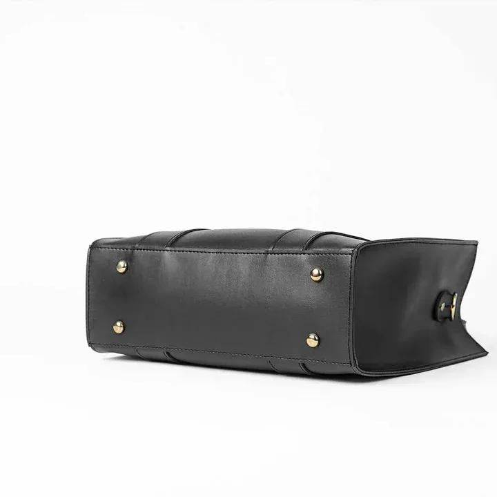 Elegant black and brown tote handbag with faux-leather finish
