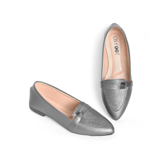 Pair of silver loafers on a white background