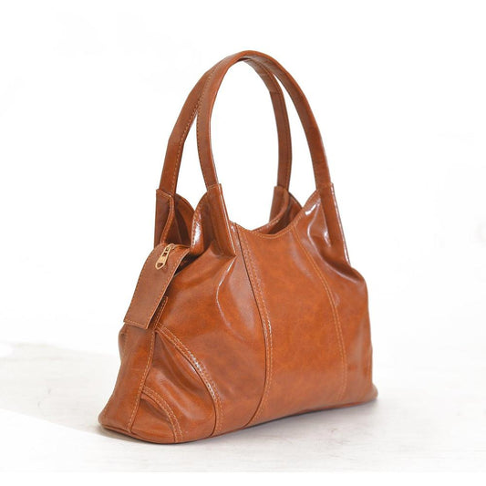 Brown leather handbag on a white background