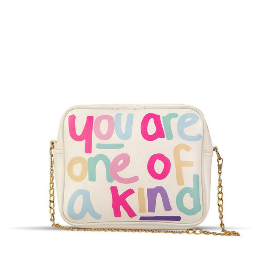 Beige crossbody bag with colorful text 'you are one of a kind' on a white background