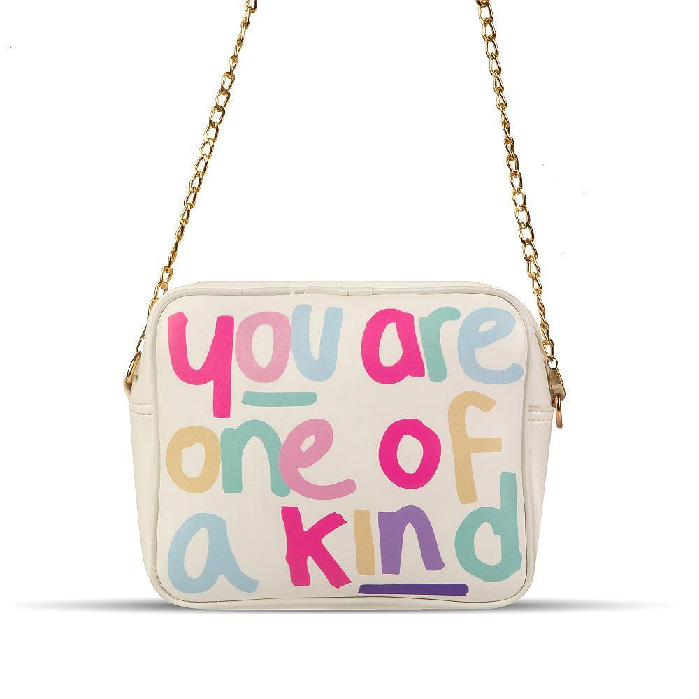 Beige handbag with colorful text 'you are one of a kind' on a white background