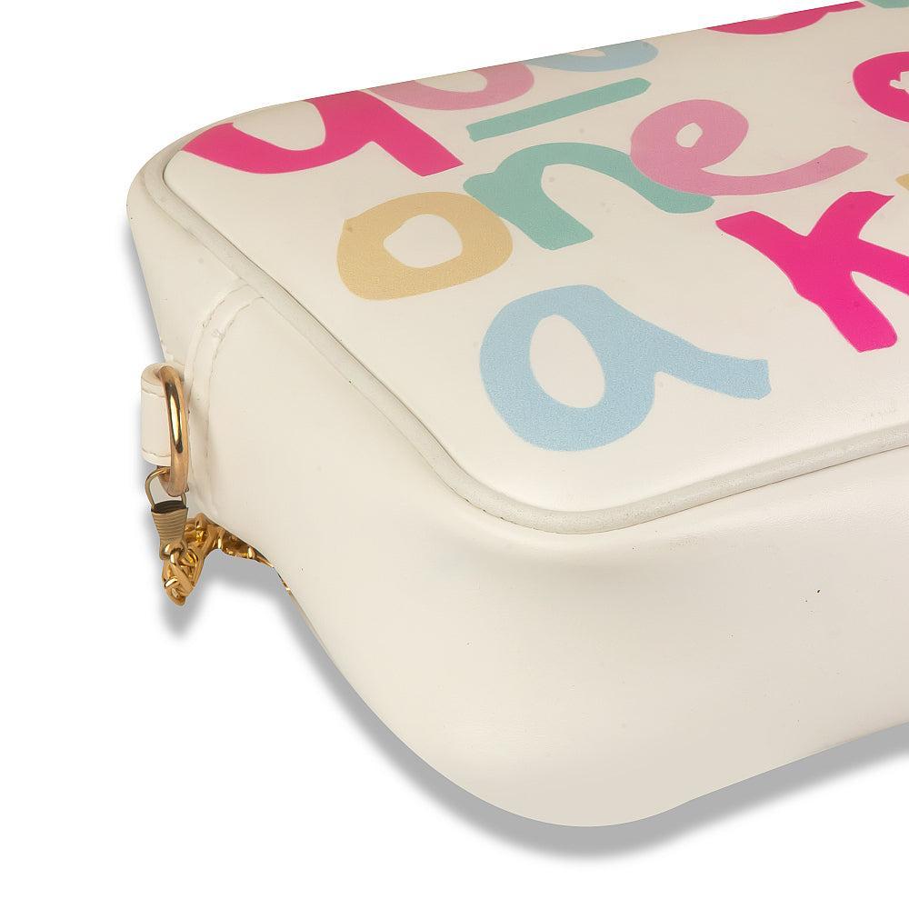 Cream-colored pouch with colorful letters on a white background