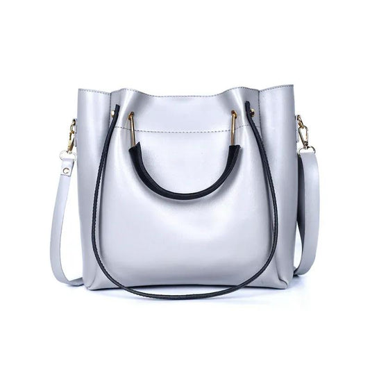 White handbag with black handle and strap on a white background