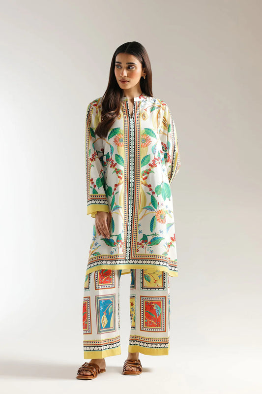 Woman wearing a colorful traditional outfit with a white background