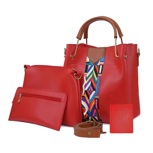 Red handbag with brown handle and strap, colorful interior, and matching wallet on a white background