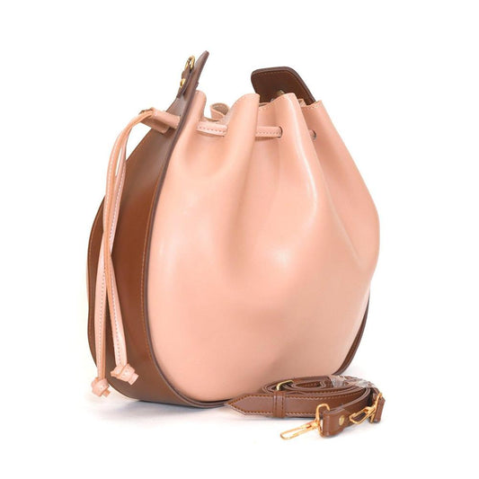 Two-tone beige and brown handbag on a white background