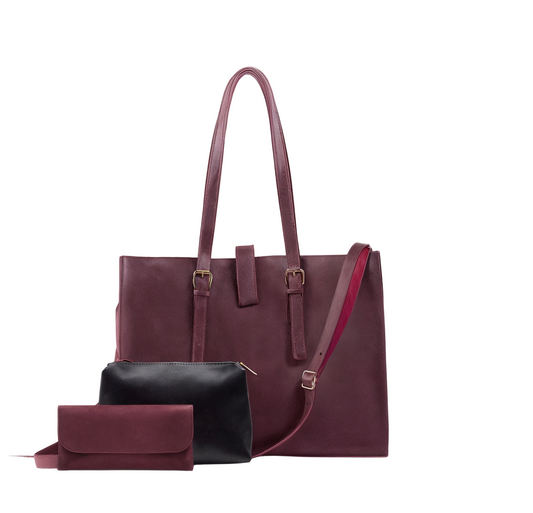 Set of maroon handbag and matching pouch on a white background