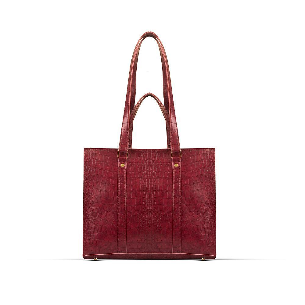 Maroon leather tote bag on a white background