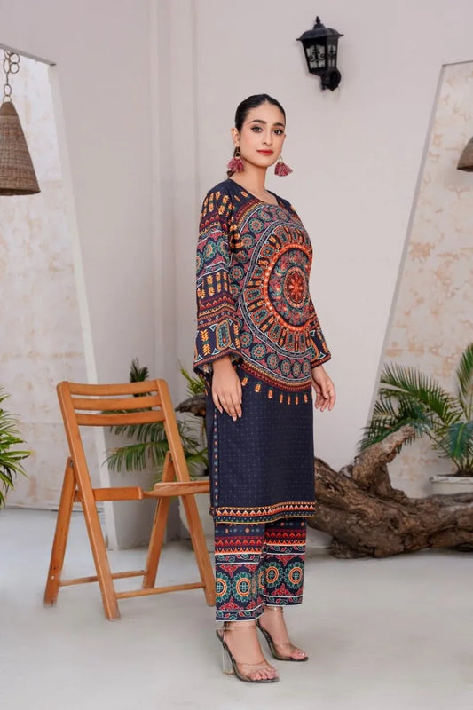 Woman wearing a colorful traditional outfit in a minimal indoor setting