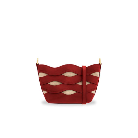 Red handbag with wavy design on a white background