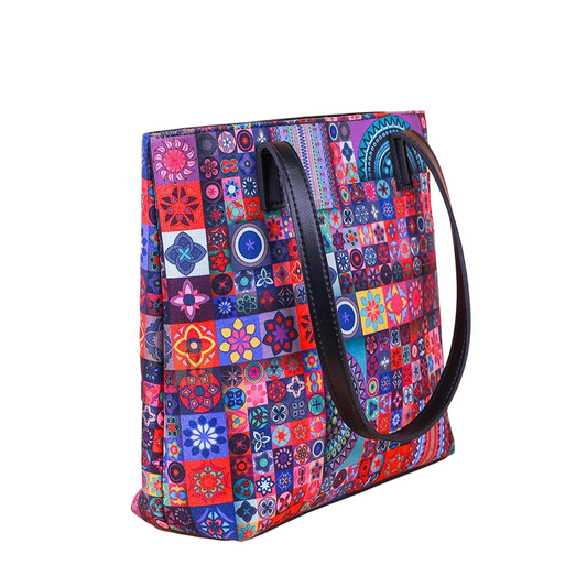 Colorful patterned tote bag with a black handle on a white background