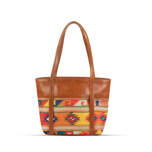 Brown tote bag with colorful patterned bottom section on a white background