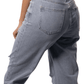 Light blue jeans worn by a lady on a white background