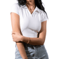 Woman wearing a white shirt and light blue jeans on a white background
