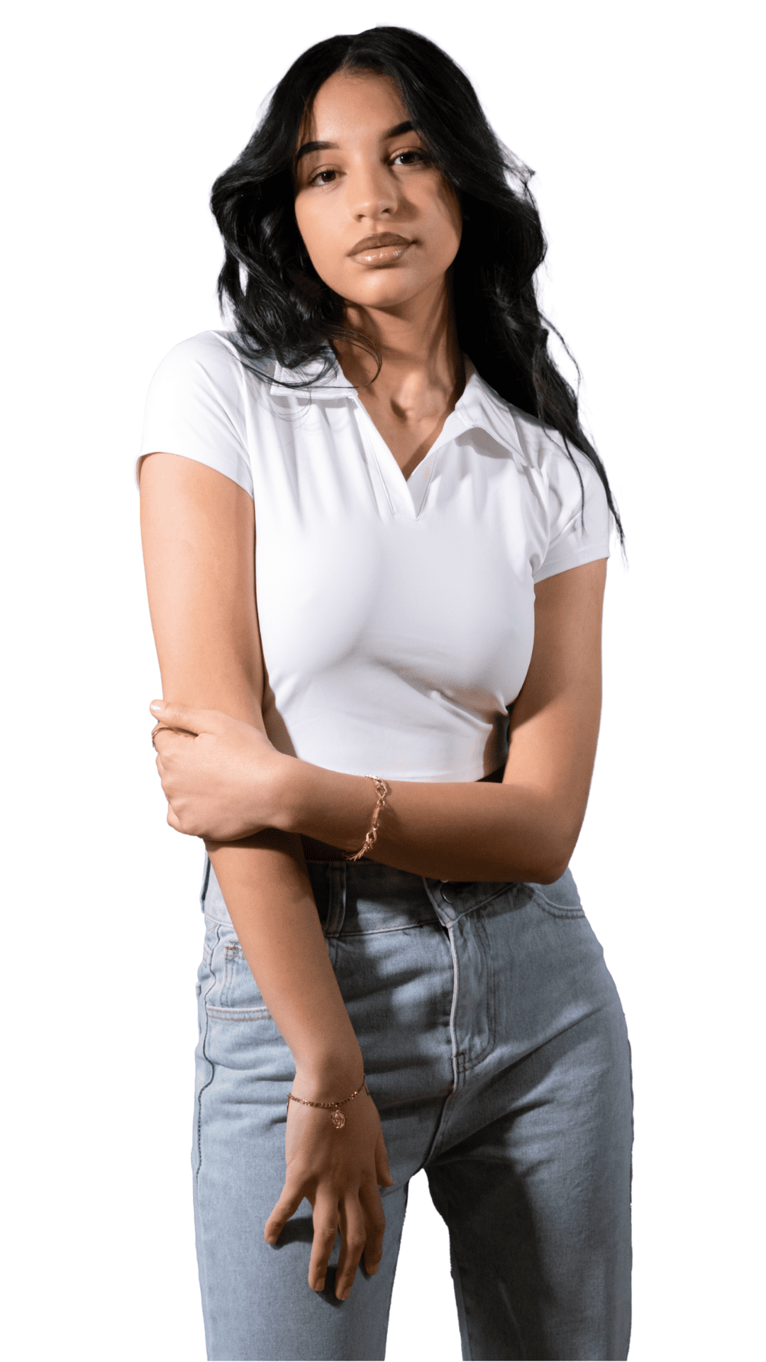 Woman wearing a white shirt and light blue jeans on a white background