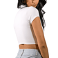 Woman wearing a white crop top and light blue jeans on a white background