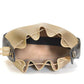 Beige leather handbag with ruffled design on a white background