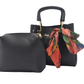 Black handbag set with a colorful scarf on a white background