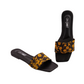Black slides with yellow floral pattern on a white background