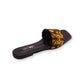 Black slide sandal with yellow pattern on a white background
