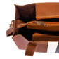 Brown leather handbag with a gold zipper on a white background