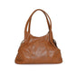 Brown leather handbag on a white background