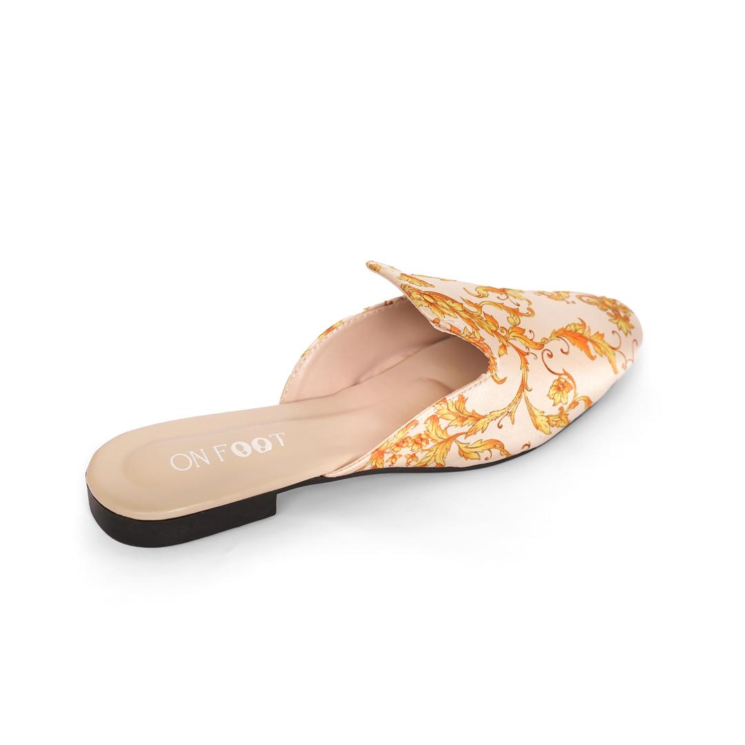 Floral patterned slipper on a white background