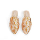 Pair of floral-patterned mules on a white background