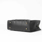Elegant black and brown tote handbag with faux-leather finish