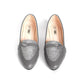 Pair of gray loafers with glittery soles on a white background