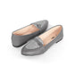 Pair of gray loafers with glittery bow on a white background