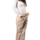 Woman wearing a white top and beige pants on a white background