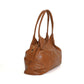 Brown leather handbag on a white background