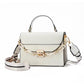 White handbag with gold chain strap on a white background