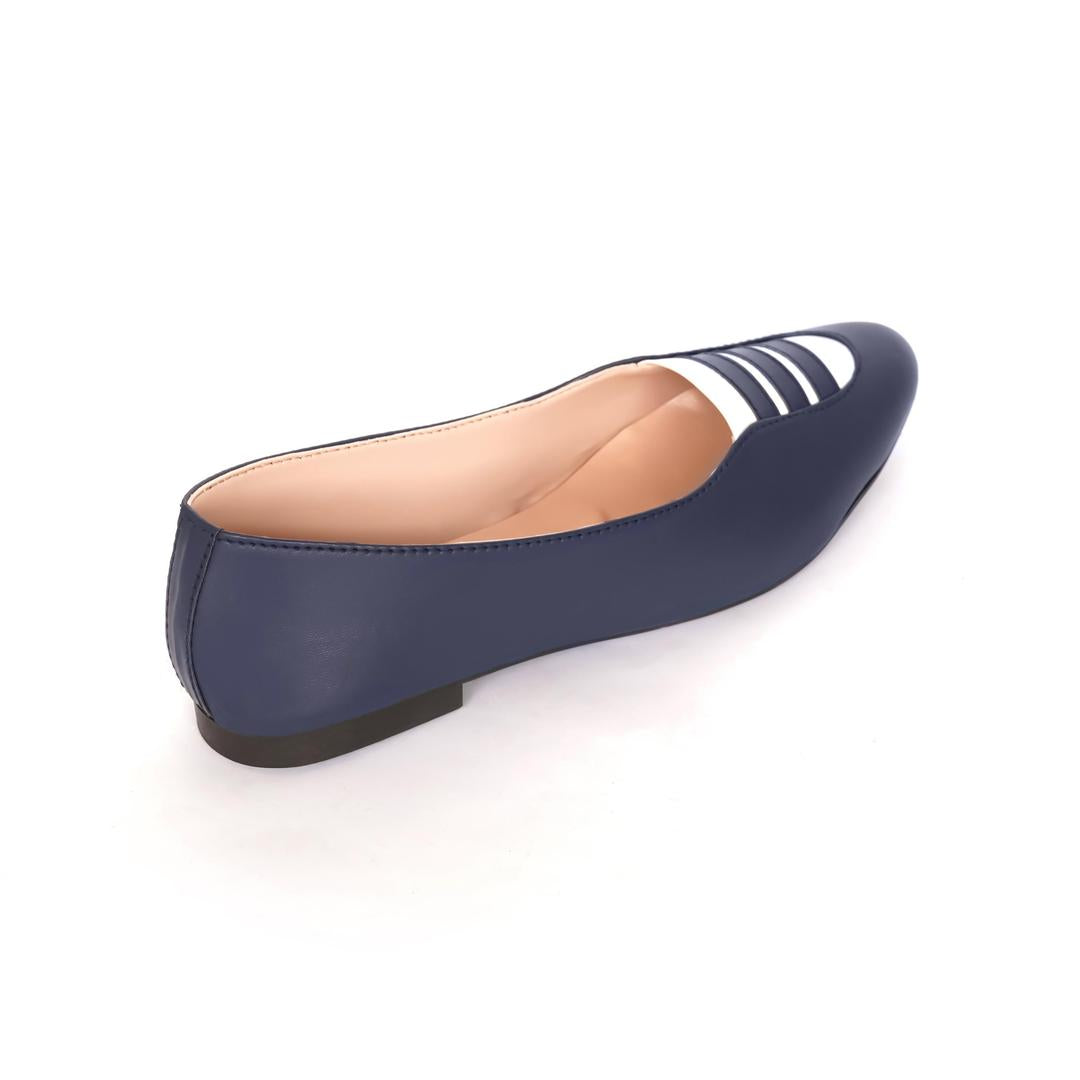 Navy blue flat shoe with white stripes on a white background