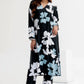 Woman wearing a black floral dress on a white background
