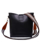 Black handbag with a striped strap on a white background