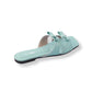 Light blue sandal with a bow on a white background