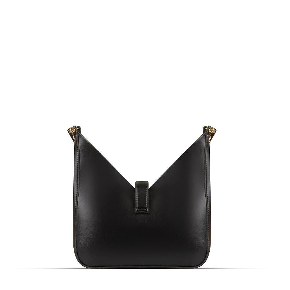 Black handbag with gold accents on a white background