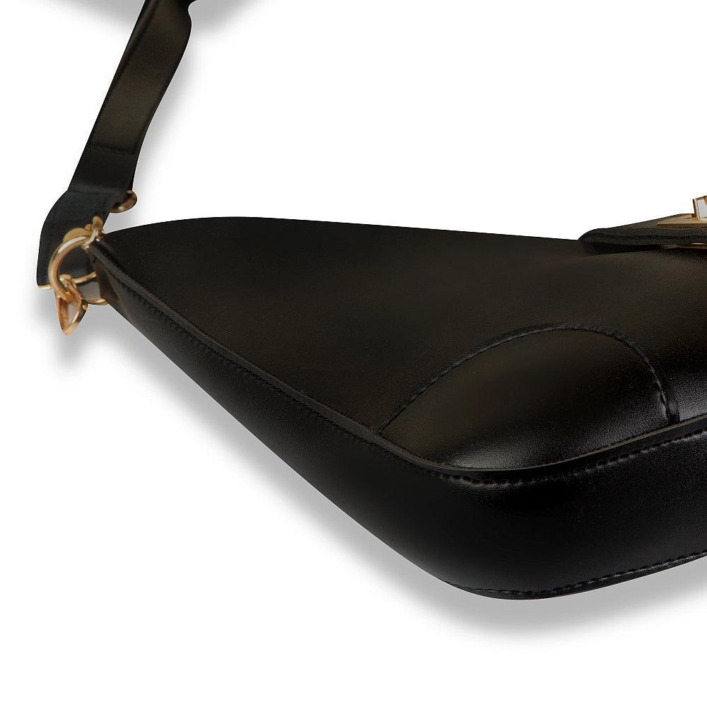 Black leather bag with a strap on a white background